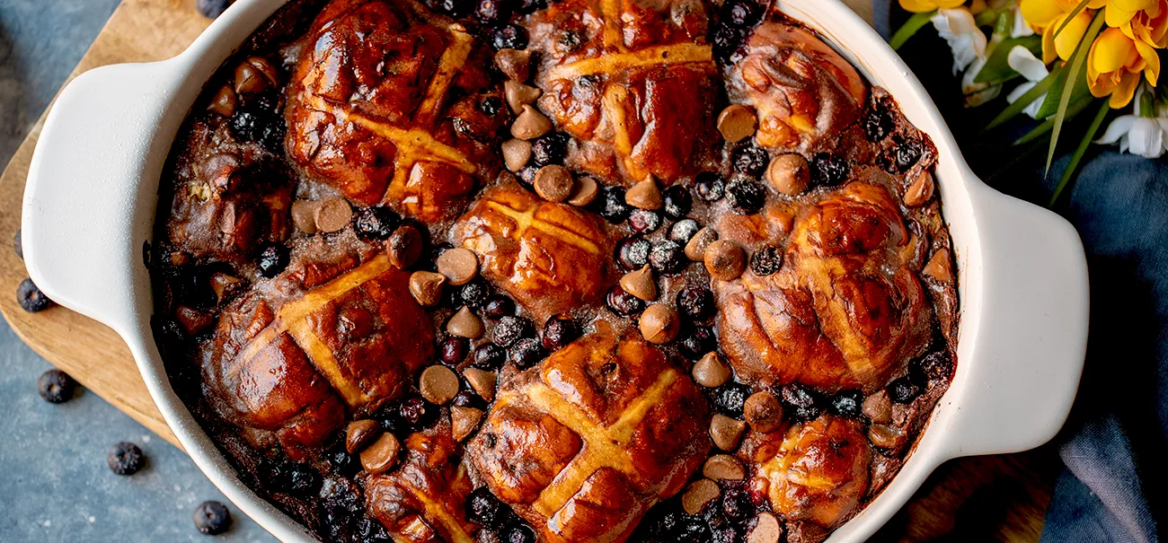 Baked casserole dish with hot cross buns and other ingredients.