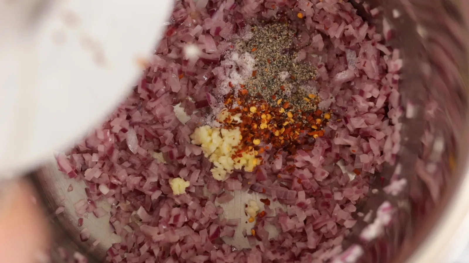 onions and spices cooking in pan