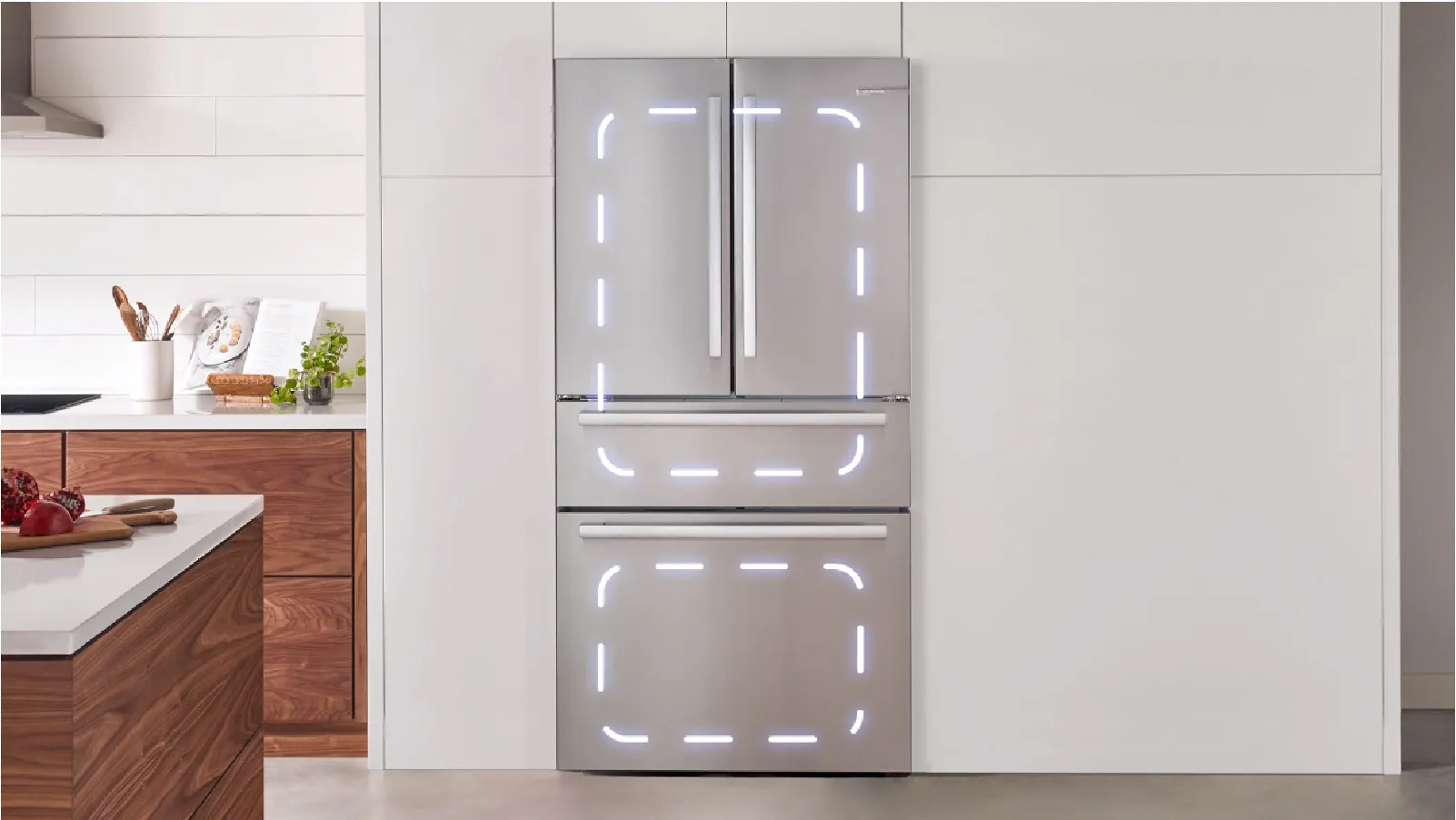 Bosch Stainless steel refrigerator with LED lights integrated into a modern kitchen setting.
