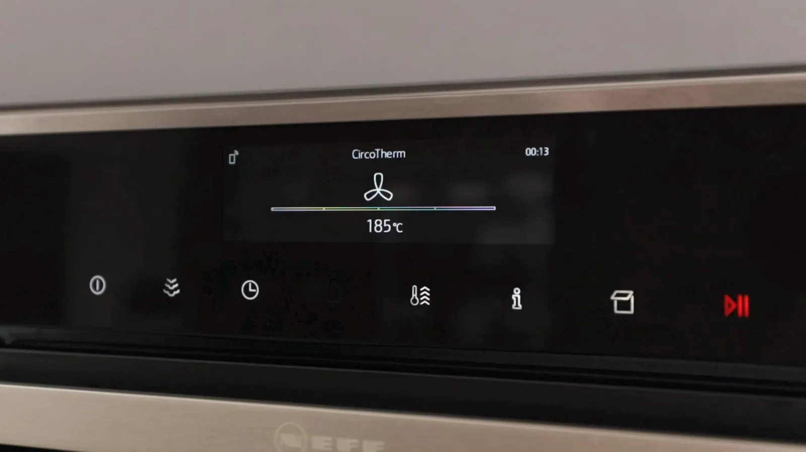 A close-up of a Neff oven's digital display showing "CircoTherm" function with a fan icon and a temperature of 185°C, with a timer set to 00:13.