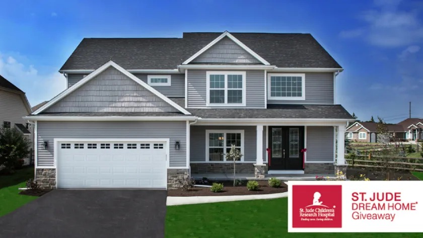 Modern two-story gray house with a lawn, featured in St. Jude Dream Home Giveaway.
