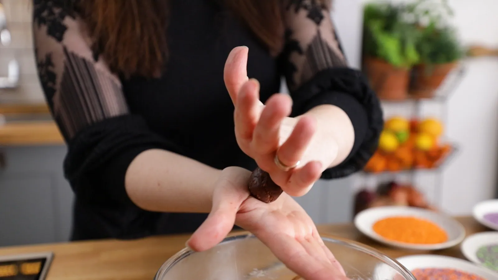 Person rolling mixture into balls