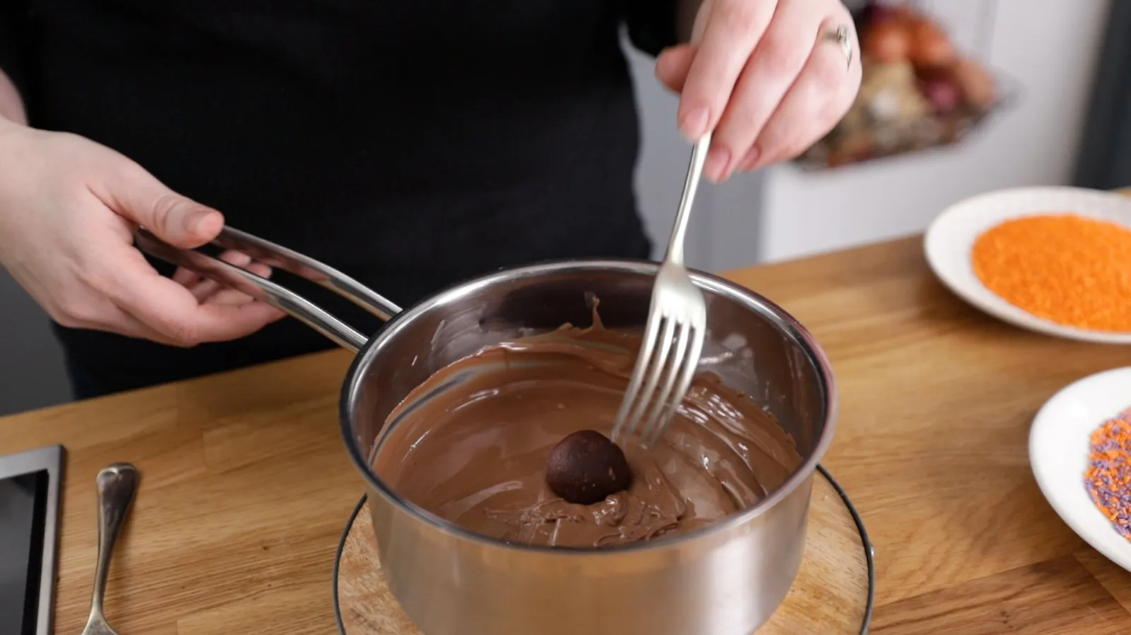 Coating mixture balls in melted chocolate