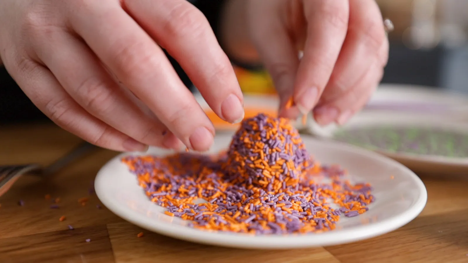 Rolling mixture balls in sprinkles