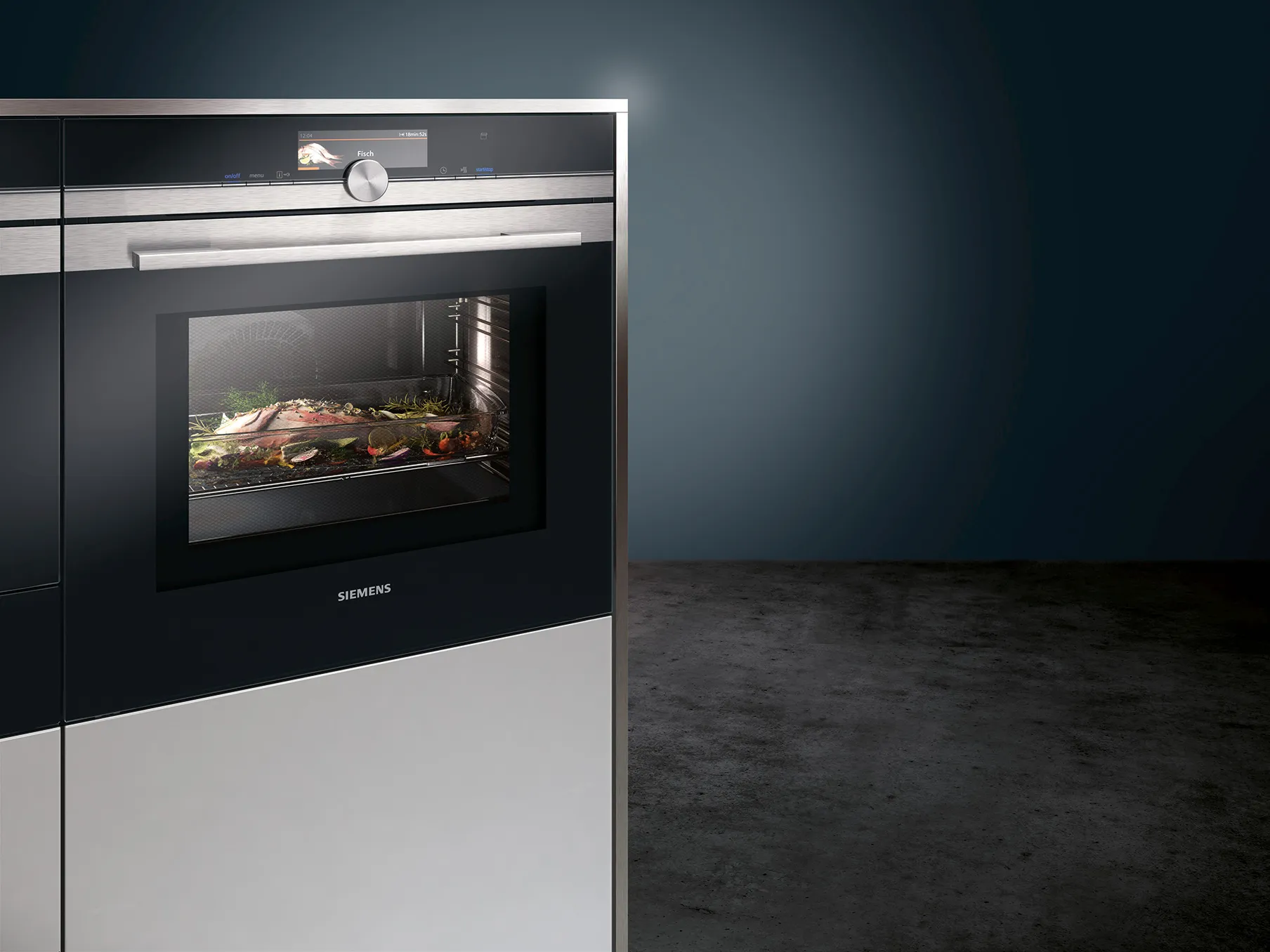 Sleek built-in oven with food inside, dark background, modern kitchen appliance.