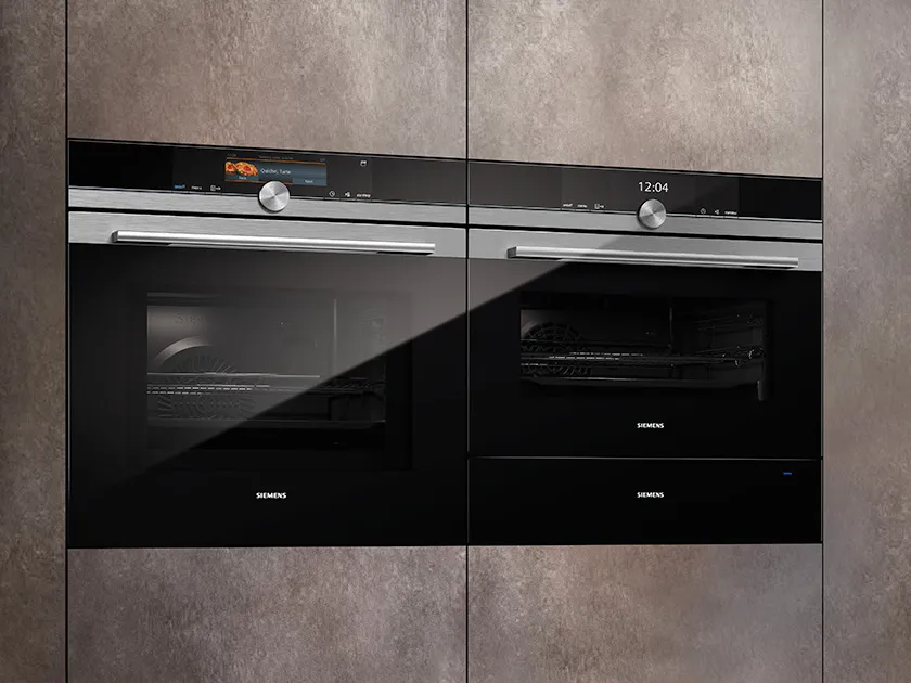 Double oven, stainless steel, modern kitchen appliance.