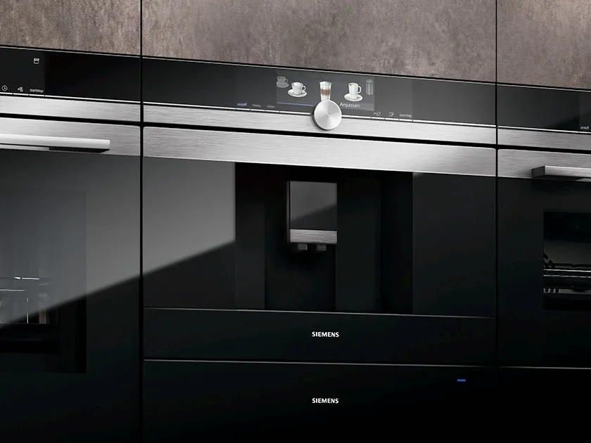 Built-in kitchen appliances, black and stainless steel design, modern minimalist aesthetic.