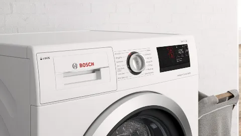 White Bosch washing machine with digital display and control panel.