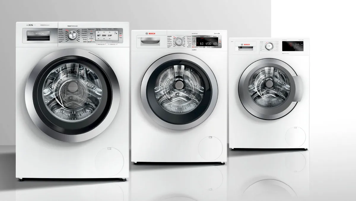 Washing machine line up on grey background