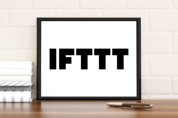 IFTTT logo in a photo frame in front of a wall