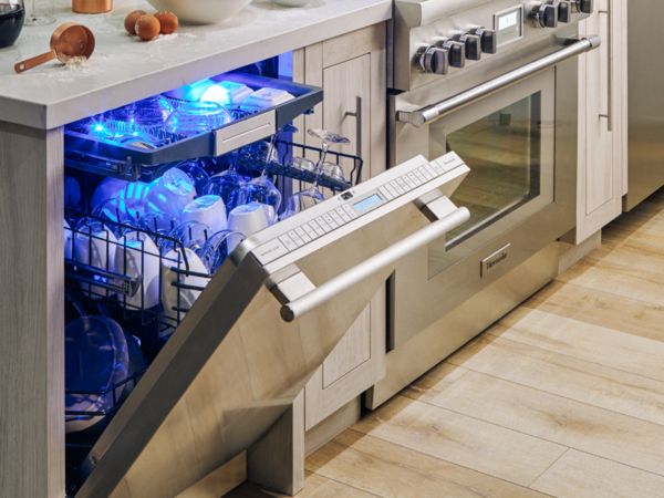thermador sapphire open dishwasher holding tableware