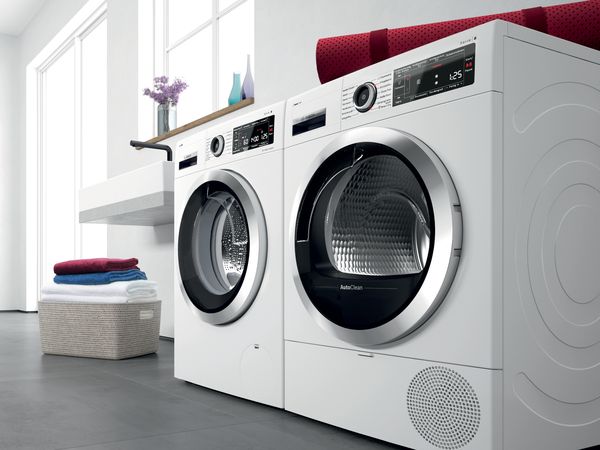 A Home Connect washing machine in a laundry room.