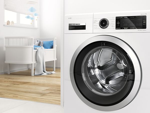 Bosch Waschmaschine mit Eco Silence Drive Motor, Kinderzimmer im Hintergrund
