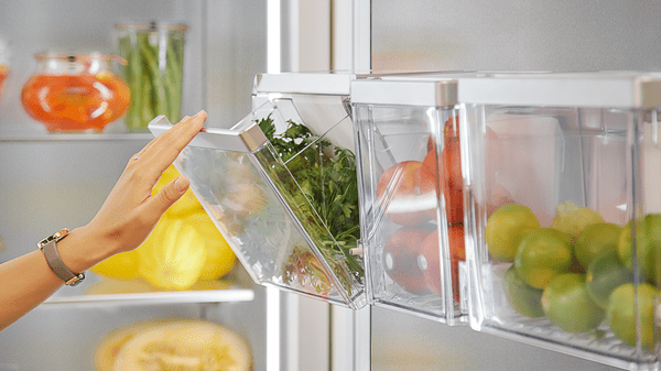 Refrigerator open with custom bins of produce