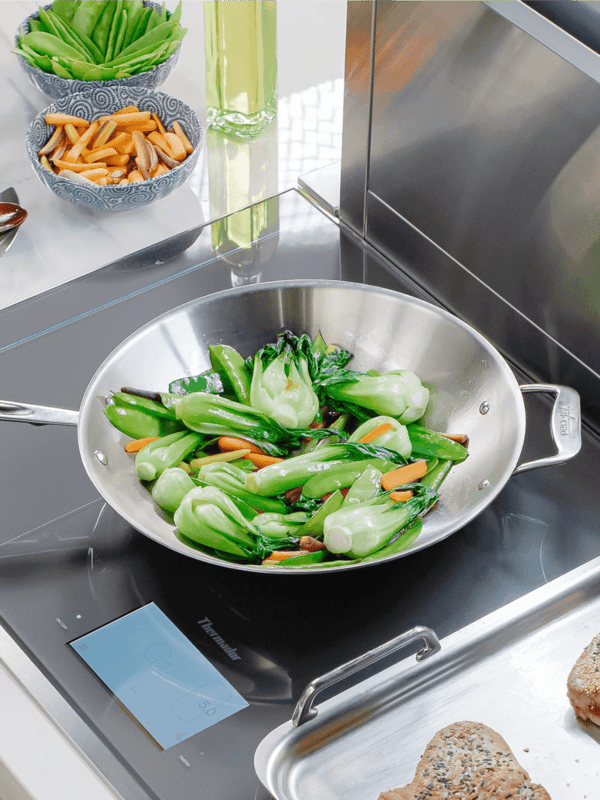 Thermador Induction Cooktop with bok choy and steak