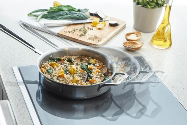 Thermador Electric Cooktop with Pan filled with food blurred