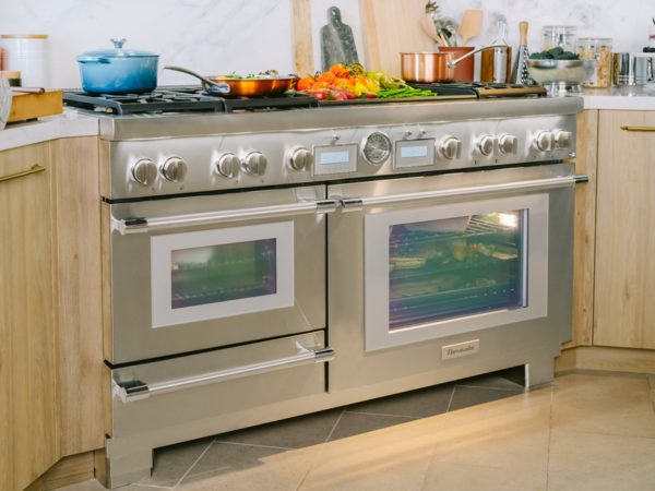 Thermador 60 inch dual fuel range with food in ovens 
