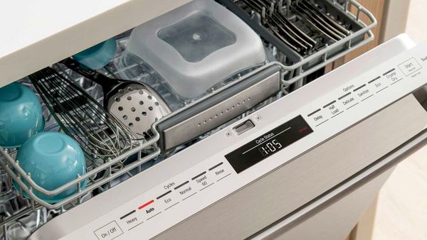 A close-up of a fully loaded dishwasher