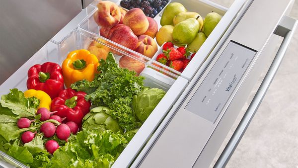 Fresh fruits and vegetables in a fridge drawer