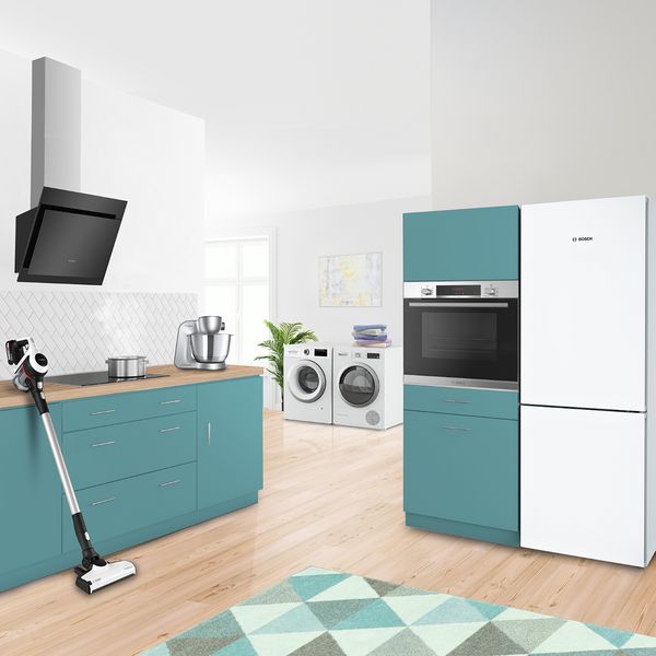 A modern kitchen featuring a vacuum cleaner and a washing machine, showcasing a blend of home appliances.  