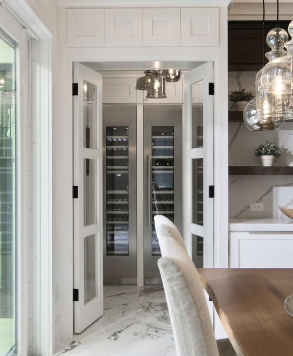 Two Thermador wine fridges in a pantry behind French doors-Photo Thermador website +IG