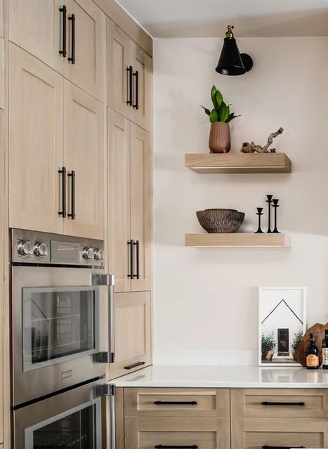 blonde oak cabinets with wall ovens