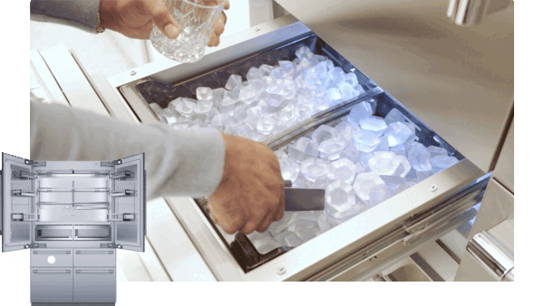 hand scooping ice from ice maker drawer