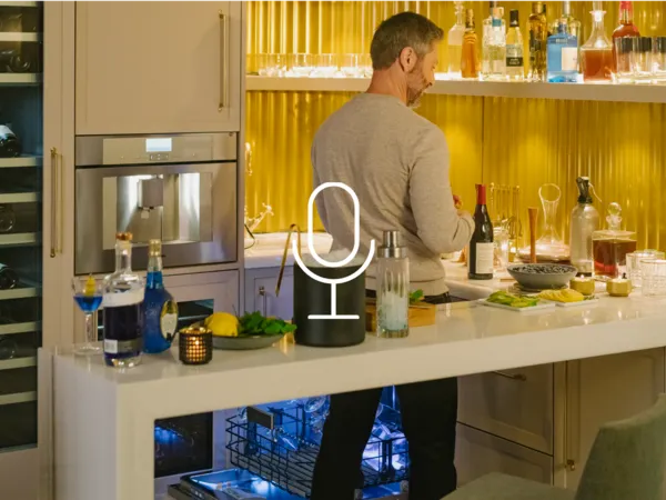 thermador-smart-coffee-machines-voice-control-with-alexa-voice-commands-man-in-yellow-mini-kitchen