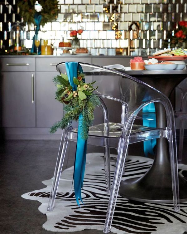 Ghost chairs with aqua blue bow & boughs