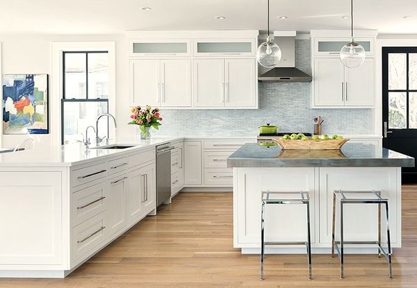 White kitchen with coloured art and accessories 