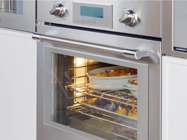thermador triple ovens closeup professional oven with food inside