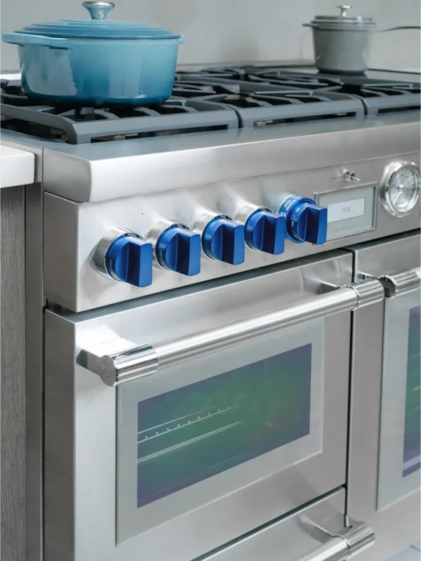 thermador craftsmanship close up blue knobs range