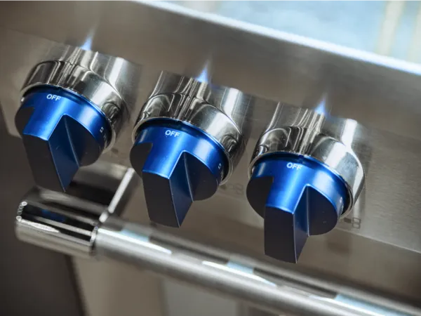 thermador blue knobs finder close up view of range knobs from above