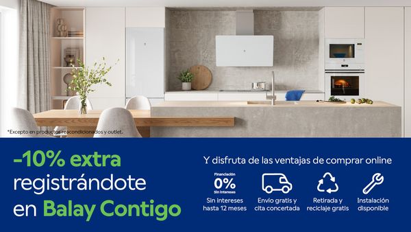 Cocina con isla y electrodomésticos blanco, promocionando un 10% de descuento extra por nuevos registros en Balay Contigo.