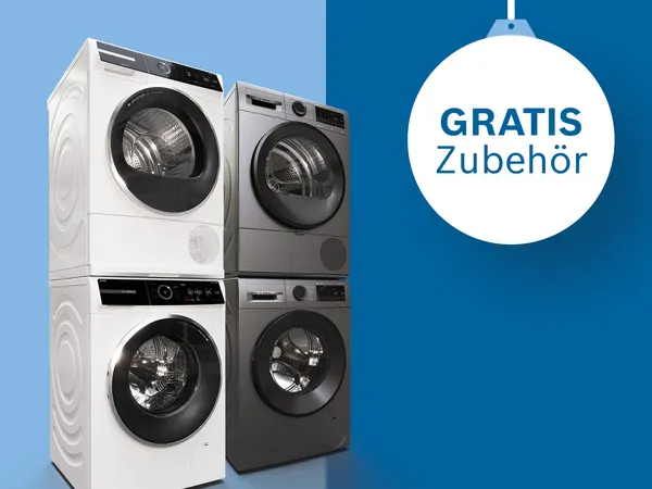 Zwei Waschtürme in einem Raum, dazu zwei sichtbare Promo-Störer im Bild.