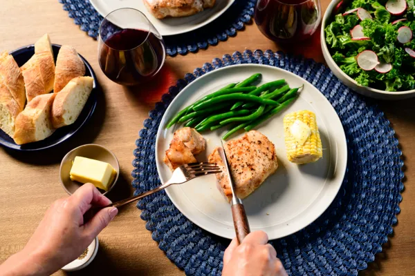 thermador air sous vide mode pork tenderloin on blue placemat
