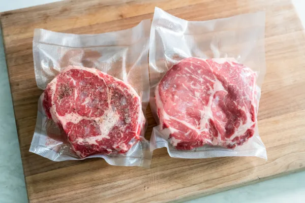 thermador air sous vide mode with vacuum sealed steaks on cutting board