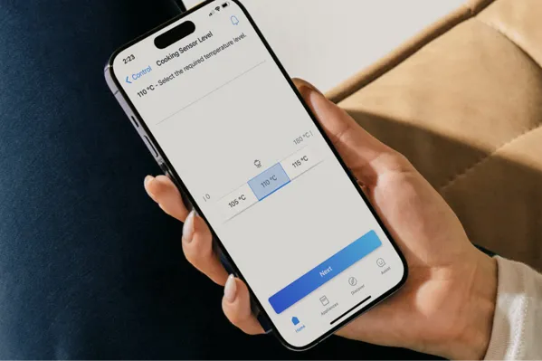 thermador induction cooktop freedom wifi enable phone in hand