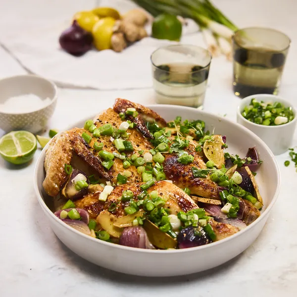 Plate of roasted vegetables, including beets, potatoes, and greens, garnished with herbs and spices.