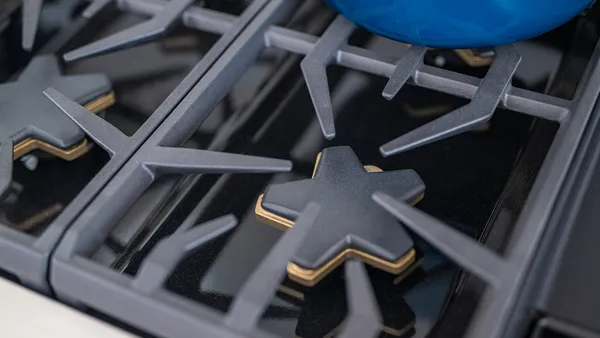 Closeup range star burner blue pot