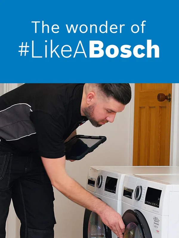 Bosch engineer looking at washing machine