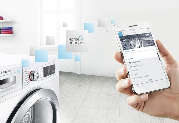 Un lave-linge Home Connect dans une buanderie.