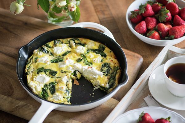 Spinach and goat cheese frittata with a side of strawberries