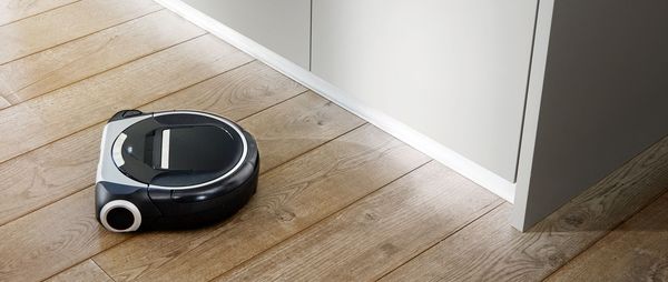 Robot vacuum cleaner on the kitchen floor