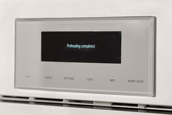 Thermador 30-inch double wall oven closeup of panel with preheat message