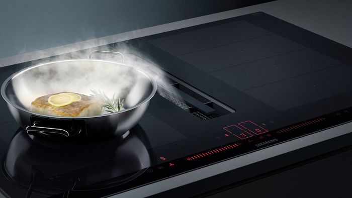 La comodidad de cocinar sin humos: Placa de cocina con extractor integrado  