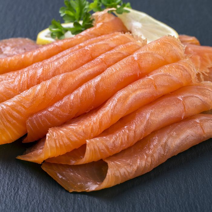 Folded slices of salmon and garnish
