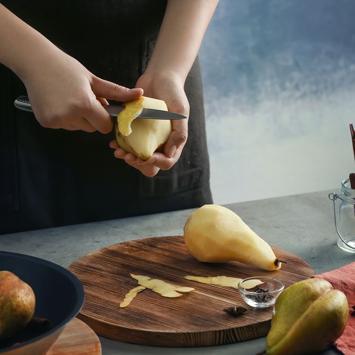 Person peeling pears