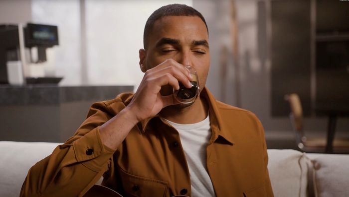 Person drinking from coffee cup