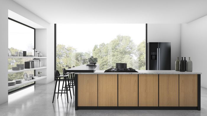 מטבח מודרני עוצב בגווני אפור שונים וכולל מכשירים ביתיים איכותיים.   